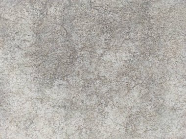 Soyut Taş Duvar arka plan, çimento efektli taşralı mermer dokusu, gri renk desenli doğal mermer figür, kum desenli. Geniş kaba beton duvar dokusu. Boş sert çimento yüzeyinin arka planı. Duvardaki çizikler çatlaklar..