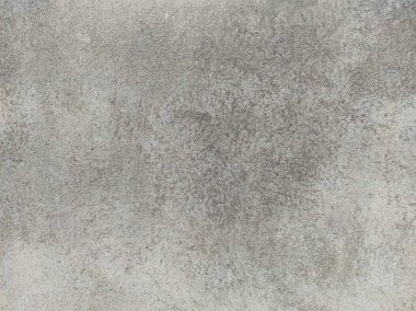 Soyut Taş Duvar arka plan, çimento efektli taşralı mermer dokusu, gri renk desenli doğal mermer figür, kum desenli. Geniş kaba beton duvar dokusu. Boş sert çimento yüzeyinin arka planı. Duvardaki çizikler çatlaklar..