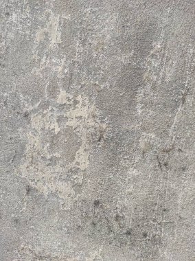 Soyut Taş Duvar arka plan, çimento efektli taşralı mermer dokusu, gri renk desenli doğal mermer figür, kum desenli. Geniş kaba beton duvar dokusu. Boş sert çimento yüzeyinin arka planı. Duvardaki çizikler çatlaklar..