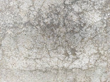 Eski Pürüzlü ve Kirli Stucco duvar arkaplanı ya da dokusu. Duvarla kaplanmış aşınmış beton duvar. Yüksek çözünürlüklü taş ve beton yüzeyler, çimento efektli arka plan mermer dokusu çizikler ve çatlaklar..