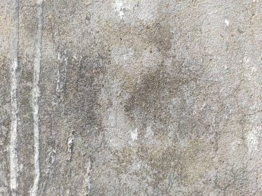 Eski Pürüzlü ve Kirli Stucco duvar arkaplanı ya da dokusu. Duvarla kaplanmış aşınmış beton duvar. Yüksek çözünürlüklü taş ve beton yüzeyler, çimento efektli arka plan mermer dokusu çizikler ve çatlaklar..