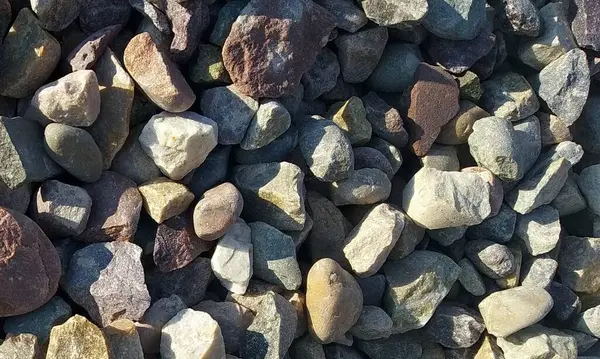 stock image Abstract background with lot of various shape peeble stones. 