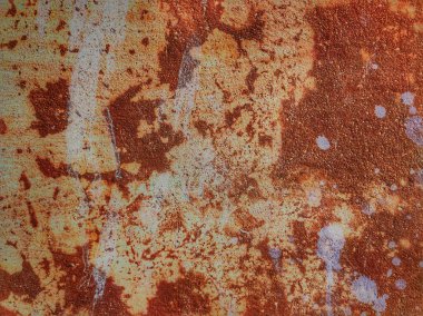 Kırmızı ve turuncu renklerle eski paslı metal duvar