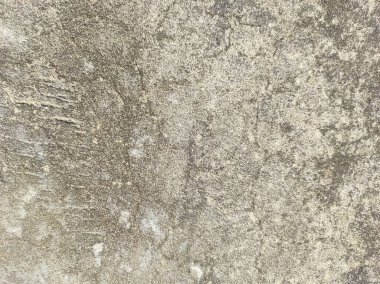 Çizikler ve çatlaklarla dolu bir duvar parçası. Eski, kirli, deri döküntüsü, duvar kâğıdının rengini soyan bir arka plan. Yüzey duvarı deseni. Soyut boya binanın duvarından dökülüyor..