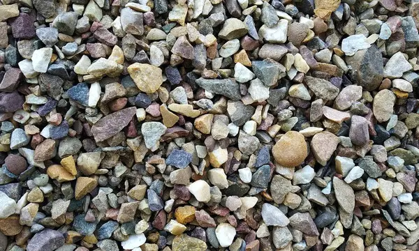 stock image Pebble stones great as a background.Close Capture on Stone Walk-way texture.Slate stone wall textured background.Gravel Texture.Terrazzo texture.Terrazzo flooring.Useful background of asphalt texture.River rock pebbles with shades of different gray.