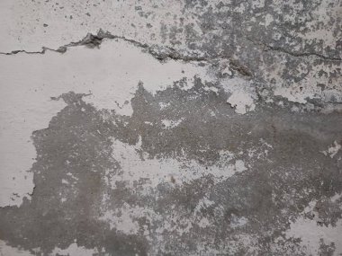 Soyut Sert ve Kirli Arkaplan Hint Duvarları. Eski, eski, eski, eski, eskimiş beton duvarlar. Sert desenler çatlamış. Soyut arkaplan için grunge desenli beton doku duvarı. Soyut zümrüt zümrüt zümrüt arka plan..