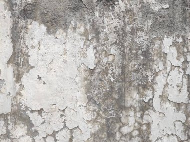 Çizikler ve çatlaklarla dolu bir duvar parçası. Renkli duvar kağıdının deseni soyan eski, kirli deri döşeme sıvası. Arkaplan için yüzey duvarı betonu deseni..