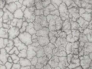 Siyah ve beyaz arka plan pankartıyla eski grunge dokusu, kirli sıkıntılı karanlık kirli kenarlar ve nötr tek renkli arkaplan tasarımında açık gri merkez. Yakın plan boyanmış taş duvar. Detaylı, gri beton arka plan dokusu..