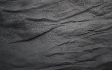 Pamuk kumaş desenleri üzerindeki soyut gri kömür arka plan ve buruşuk doku tasarımları. Tekstil satışı, broşür, duvar kağıdı, afiş, web başlığı, arkaplan vs. için alan ideallerini kopyala.,
