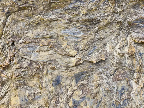 Doğal kaya yüzeyinin, pürüzlü, pürüzsüz, pürüzlü, pürüzlü arkaplan dokusuyla yakın görüntüsünü al.. 