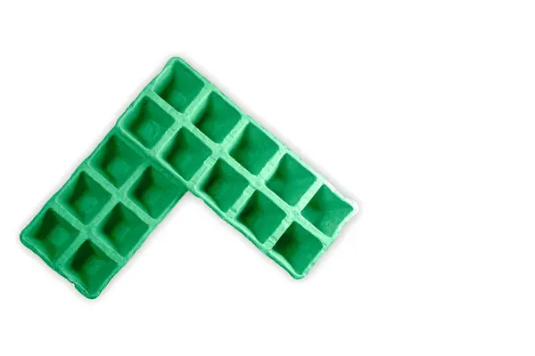 Soyut üst görünüm 10 delik yeşil, biyolojik olarak çözünebilir saksılar, çöp öğütücü kağıt filizleme tepsisi, bahçe hobisi.