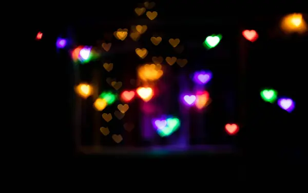 Renkli, soyut kalp desenli, duvar kağıdı arkaplanlı bokeh ışığı parıltısı. Sevgililer Günü teması, düğün teması vs.., 