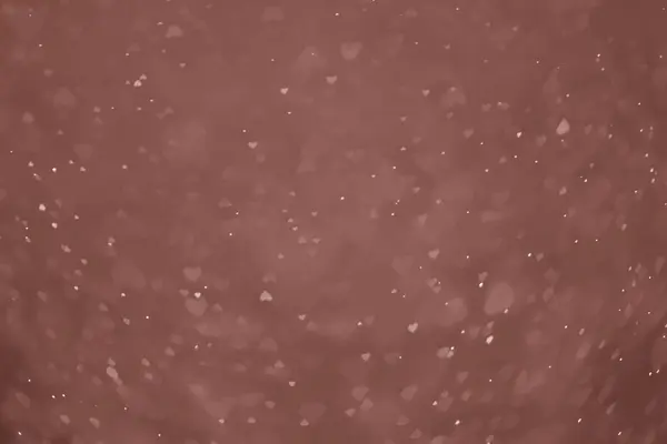 Sevgililer Günü arkaplanı klasik serçe parmak kahverengi gradyan üzerinde parlıyor.