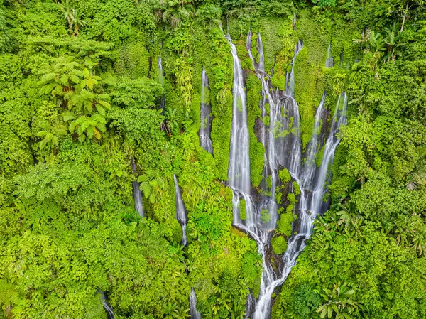 Sinulom waterfalls with beautiful water cascades among the plants. Mindanao, Philippines.
