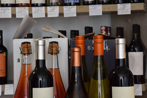 Wine bottles in wine store, restaurant, cafe, bar and ready for home delivery