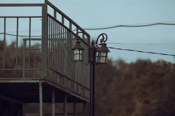 old rusty metal lamp on the street