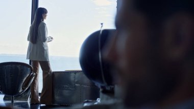 Stressed businessman portrait thinking closeup. Focused man pondering about relationships problem at office. Unrecognized businesswoman silhouette looking window in dark hotel. Divorced couple concept