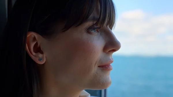 Boss woman dreaming ocean view window closeup. Ambitious professional manager director looking in distance. Businesswoman enjoying life moving shot portrait. Sea business trip vacations concept
