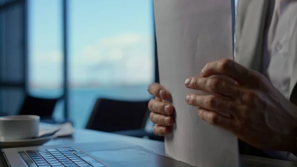 Businessman hands reading documents at office closeup. Unrecognizable manager arms contract at ocean view place. Unknown director keeping business papers at panoramic window hotel slow motion