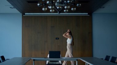 Focused manager solving problem alone. Frustrated businesswoman walking room looking inspiration making difficult decision in meeting room. Stressed ceo lawyer feel stuck desperate. Job career concept