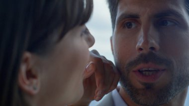 Spouses talking in sea view luxury hotel portrait. Romantic couple embracing against panoramic window closeup. Man and woman in love showing tenderness on honeymoon dating. Relationship concept