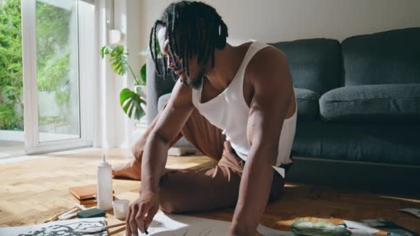 Contemporary Man Painting Paper Light Apartment Closeup Black Hair Guy — Video