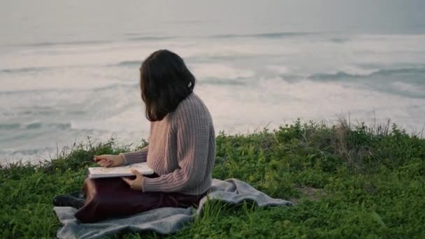Lonely Brunette Sitting Blanket Book Looking Gloomy Seascape Alone Attractive — Stock video