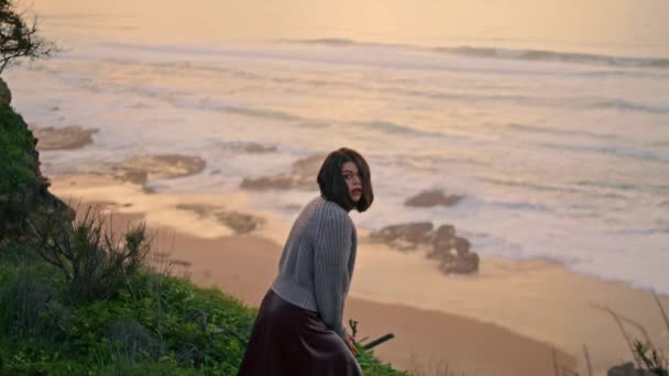 Sad Pensive Woman Sitting Green Grass Seacoast Front Ocean Waves — Video