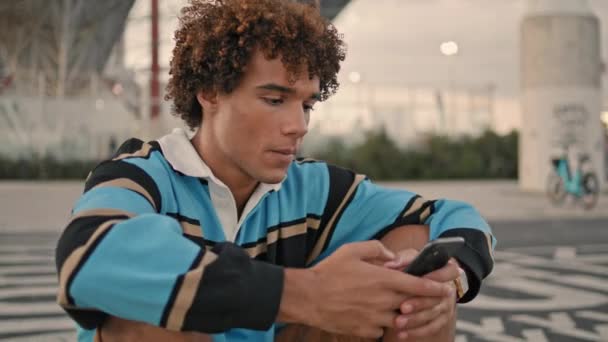 Young Teen Chatting Cellphone Outdoors Closeup Curly Hair Guy Communicating — Video