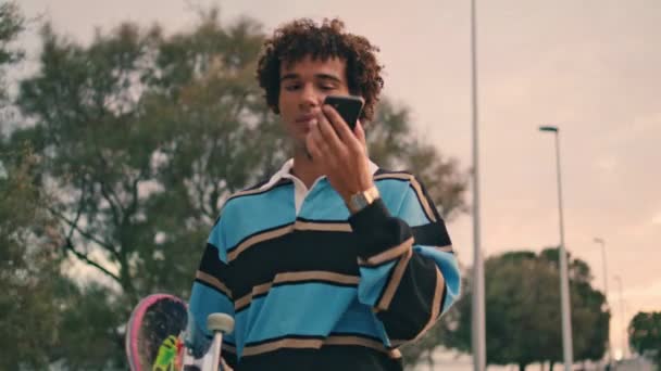 Millennial Skater Speaking Cellphone Sunset City Closeup Contemporary Young Man — Video Stock