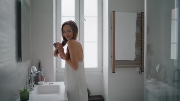 Positive Lady Arranging Hair Bathroom Interior Smiling Woman Staring Camera — Stock videók