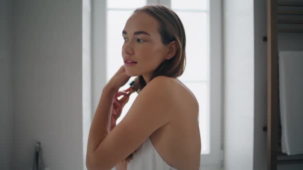 Satisfied Model Brushing Hair Bathroom Closeup Tender Girl Looking Camera — Vídeos de Stock