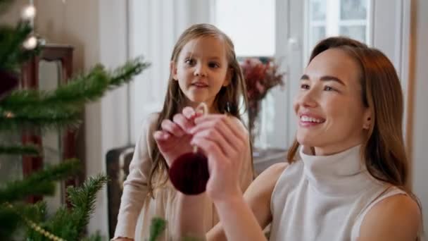 Smiling Woman Hanging Xmas Toy Branch Portrait Overjoyed Baby Clapping — Vídeo de Stock