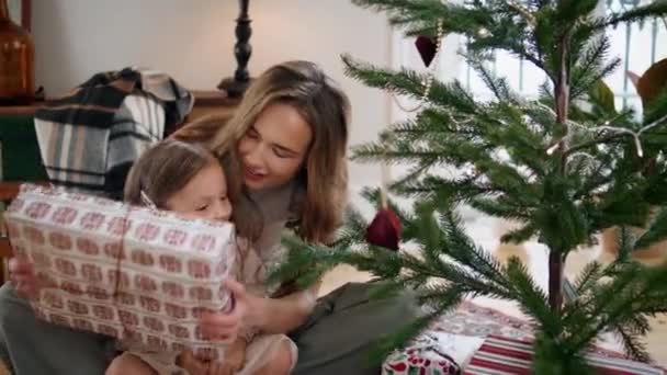 Caring Mother Presenting Gift Baby Daughter Cozy Place Surprised Girl — Vídeo de Stock