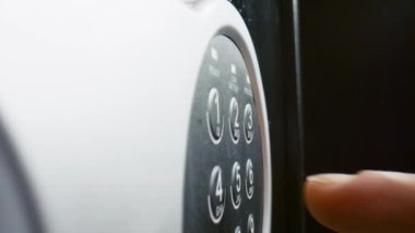 Man fingers pressing pass code on metal safe electronic panel close up. Unknown person pushing keys on safety lock entering correct password. Male hand opening door secret protective strongbox.