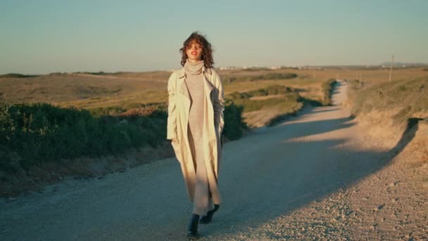 Relaxed Girl Walking Pathway Autumn Sunlight Smiling Woman Enjoying Nature — Video