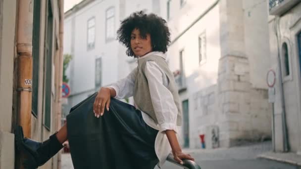 Elegant Black Hair Girl Sitting Railings Empty City Street Close — Stockvideo