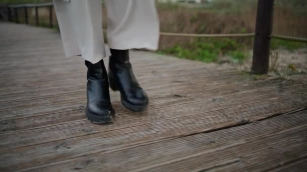 Autumn Boots Walking Wooden Path Closeup Calm Traveler Legs Strolling — Vídeos de Stock