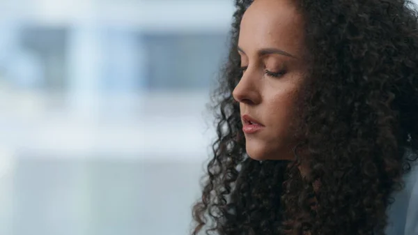 stock image Closeup tired manager feeling exhausted work computer. Sad overworked employee having business failure. Latin lady experiencing disaster at office. Dissatisfied woman thinking at panoramic skyscraper