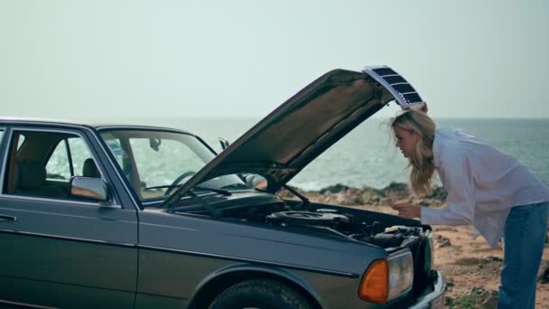 Woman Closing Car Hood Feeling Confused Standing Sunny Ocean Shore — Stock Video