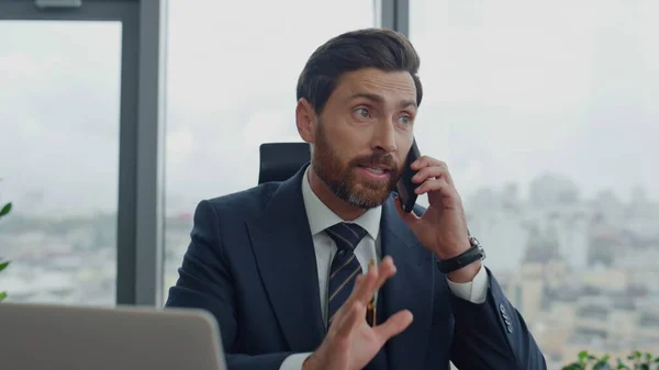 Busy company employee talking phone with boss noting work issues in notebook close up. Middle-aged bearded business man have telephone conversation discussing corporate problem. Ceo using smartphone.