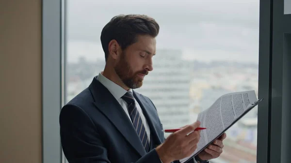Focused Bearded Businessman Reading Contract Terms Feeling Satisfied Standing Office — Stock Photo, Image