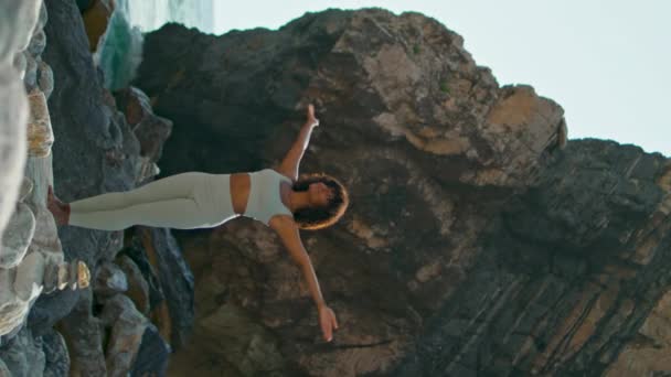 Peaceful Slim Girl Exercising Stone Seashore Raising Hands Sky Vertical — Stock Video