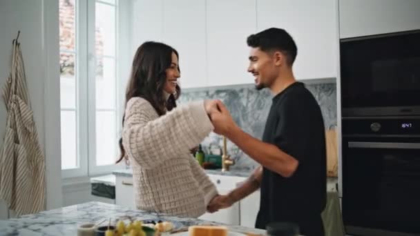 Playful Spouses Embracing Modern Apartment Romantic Couple Hugging Luxury Kitchen — Stock Video