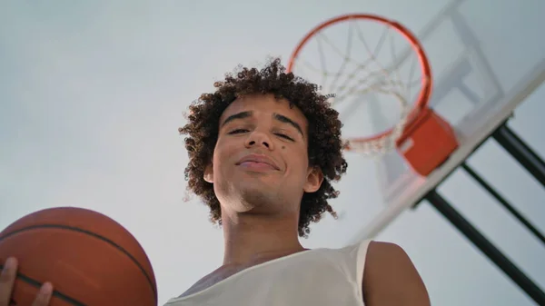 Smiling Sportsman Holding Ball Stadium Low Angle Young Basketball Player — Stockfoto