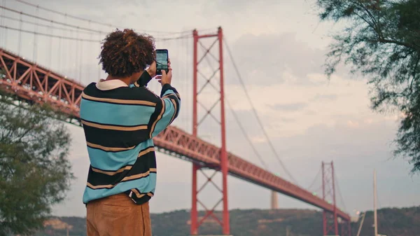 Young Tourist Photographing Bridge Cloudy Evening Closeup Modern Guy Holding — Stock fotografie