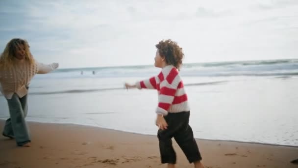 Cute Son Running Mother Autumn Seaside Happy Babysitter Embracing Child — Stock Video