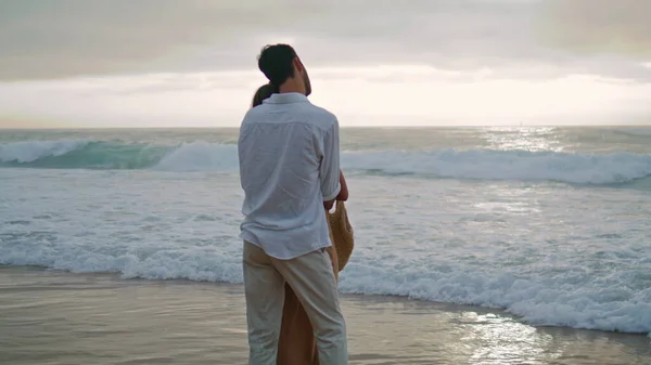Romantic Lovers Dating Ocean Evening Beach Latin Man Embracing Unknown — Φωτογραφία Αρχείου