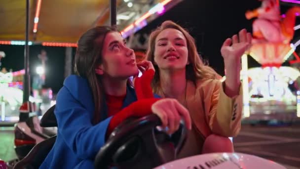 Girls Rest Amusement Park Illuminated Carousel Closeup Two Smiling Friends — Stock Video