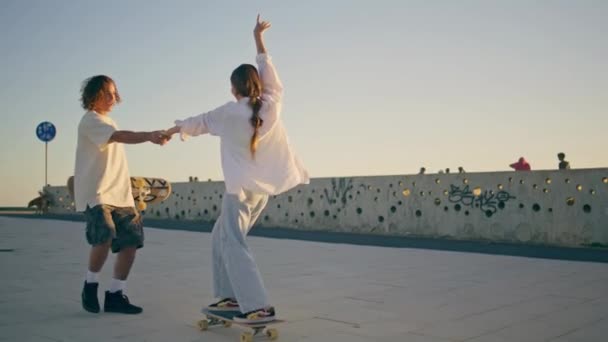 Teen Pair Riding Skate Board Enjoying Speed Sunset Stadium Active — Stock Video